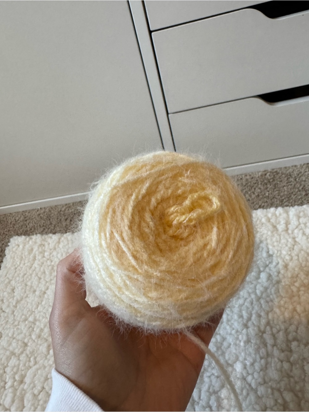 4.06 oz Colorama Halo Yarn in color beeswax frost weight 5 yarn